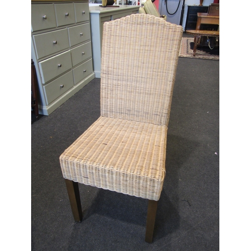 1022 - A modern light oak dining table, reeded square legs, together with a set of four rattan dining chair... 