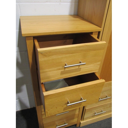 1040 - A modern light oak set of five drawers, 127cm tall