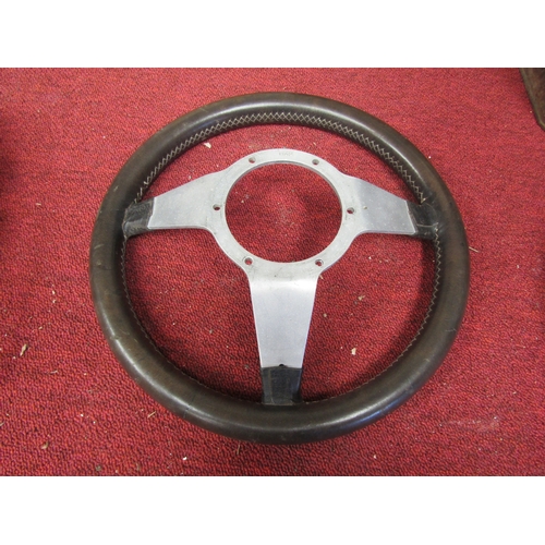 8015 - A chrome and leather steering wheel