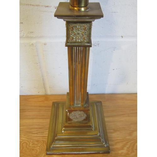 1020 - A Victorian brass column oil lamp with cranberry acid etched shade