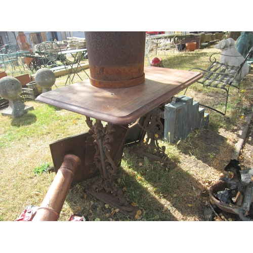 6024 - A cast iron based pub table with wooden top, 90cm x 57cm