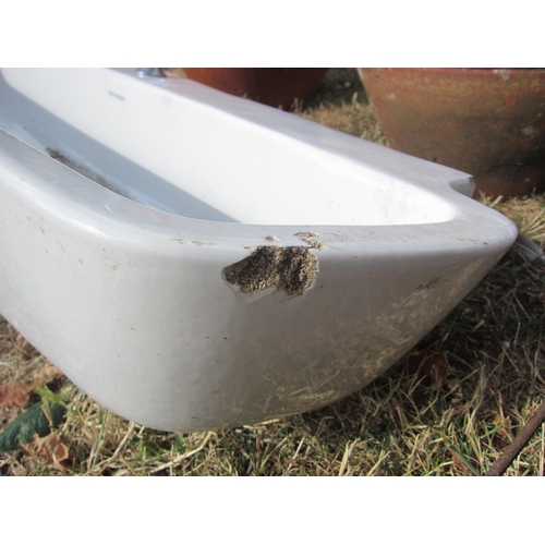 6050 - A long glazed Twyfords cloakroom sink, 107cm wide, chip to front right corner
