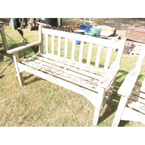 6064 - A weathered hardwood garden bench, 128cm wide