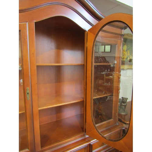 1034 - A three glazed door dresser over a three drawer and three door cupboard base with key, 220cm tall x ... 