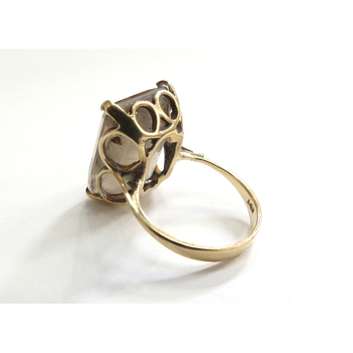 A gold ring set with a large smoky quartz, stamped 14k. Size K/L, 6.1g