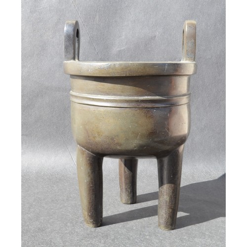 7001 - A bronze 18thc Chinese silver inlaid twin handled tripod ding (censer) profusely inlaid arcahaic sty... 