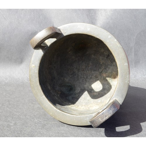 7001 - A bronze 18thc Chinese silver inlaid twin handled tripod ding (censer) profusely inlaid arcahaic sty... 
