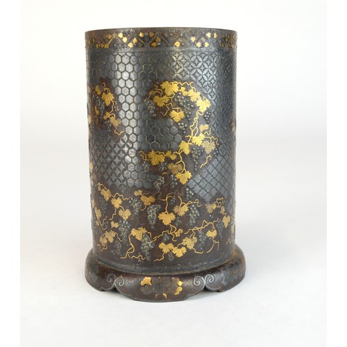 7005 - A Japanese bronze and mixed metal cylindrical vase decorated with fruiting grape vines in gold and s... 