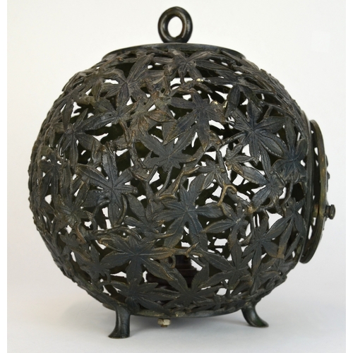 7002 - A bronze Japanese spherical openwork lantern decorated with bamboo leaves, converted to hold a light... 
