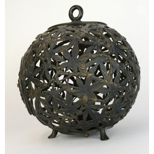 7002 - A bronze Japanese spherical openwork lantern decorated with bamboo leaves, converted to hold a light... 