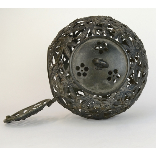 7002 - A bronze Japanese spherical openwork lantern decorated with bamboo leaves, converted to hold a light... 