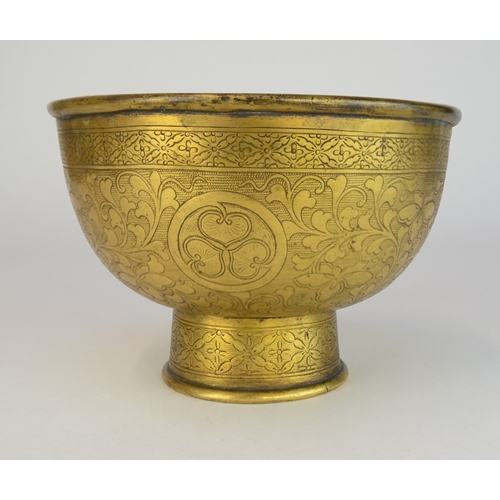 7003 - A Japanese gilt brass pedestal bowl decorated with incised flowers and mons

 10cm high

 Provenance... 