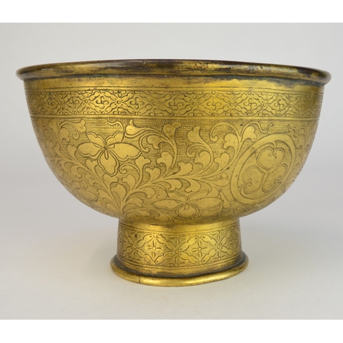 7003 - A Japanese gilt brass pedestal bowl decorated with incised flowers and mons

 10cm high

 Provenance... 