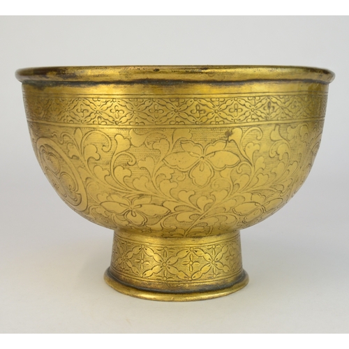 7003 - A Japanese gilt brass pedestal bowl decorated with incised flowers and mons

 10cm high

 Provenance... 