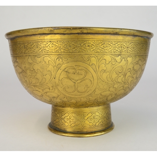 7003 - A Japanese gilt brass pedestal bowl decorated with incised flowers and mons

 10cm high

 Provenance... 