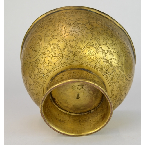 7003 - A Japanese gilt brass pedestal bowl decorated with incised flowers and mons

 10cm high

 Provenance... 