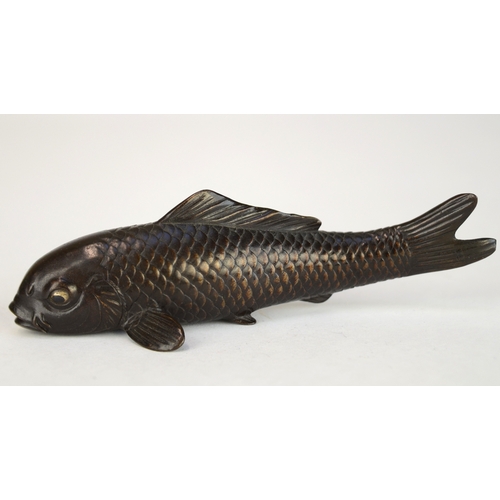 7007 - A Japanese bronze okimono of a carp, signed

 9.5cm wide

 Provenance
 Henry Potter Stevens Collecti... 