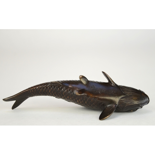 7007 - A Japanese bronze okimono of a carp, signed

 9.5cm wide

 Provenance
 Henry Potter Stevens Collecti... 