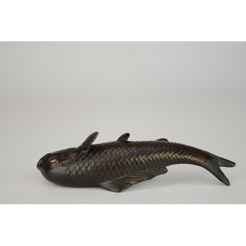7007 - A Japanese bronze okimono of a carp, signed

 9.5cm wide

 Provenance
 Henry Potter Stevens Collecti... 