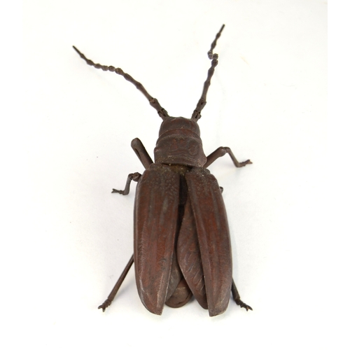 7008 - A Japanese jizai okimono of an articulated Asian long horned beetle, signed under wing

 Provenance
... 