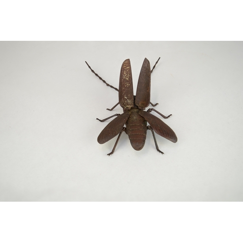 7008 - A Japanese jizai okimono of an articulated Asian long horned beetle, signed under wing

 Provenance
... 