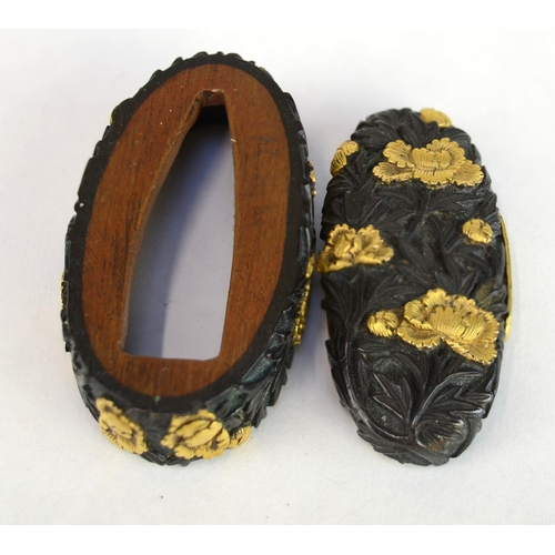 7009 - A fuchi and gashira (pommel and hilt) set decorated with peonies in shakudo and gilt takazogan, unsi... 