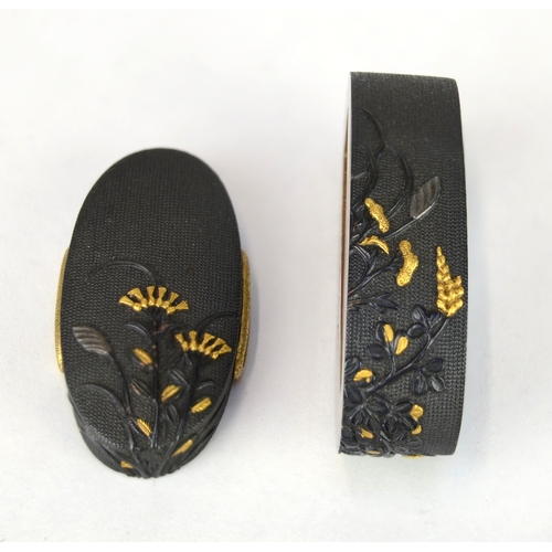 7011 - A fuchi and gashira (pommel and hilt) set decorated in shakudo with takazogan flowers, signed

 Prov... 