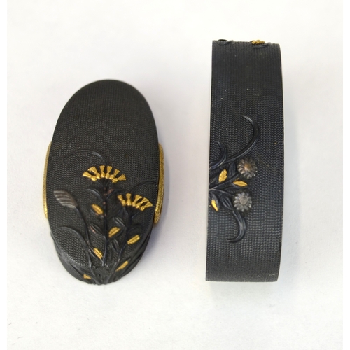 7011 - A fuchi and gashira (pommel and hilt) set decorated in shakudo with takazogan flowers, signed

 Prov... 
