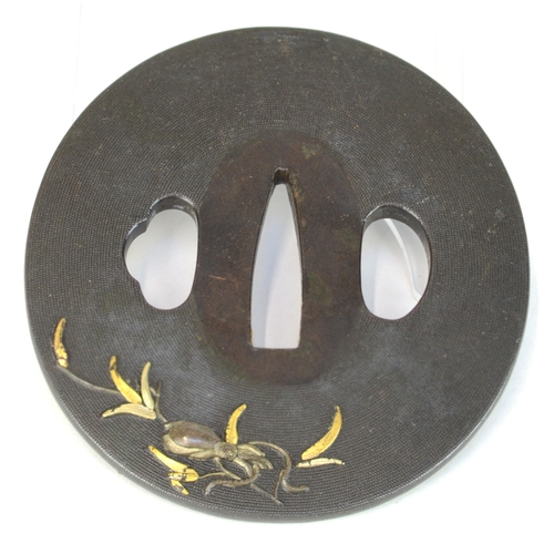 7015 - A shakudo tsuba decorated with takazogan fish and bamboo stems with gold leaves, the other side deco... 