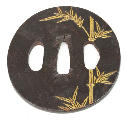 7021 - Five iron tsuba, small oval with bamboo stems in gold, oval with lily flowers, kakumarugata with che... 