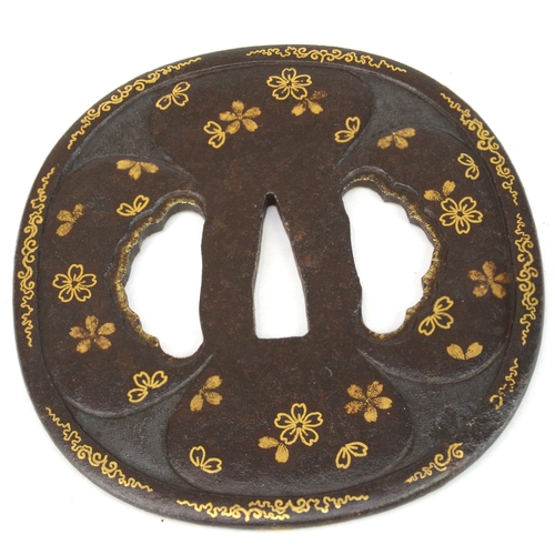 7021 - Five iron tsuba, small oval with bamboo stems in gold, oval with lily flowers, kakumarugata with che... 