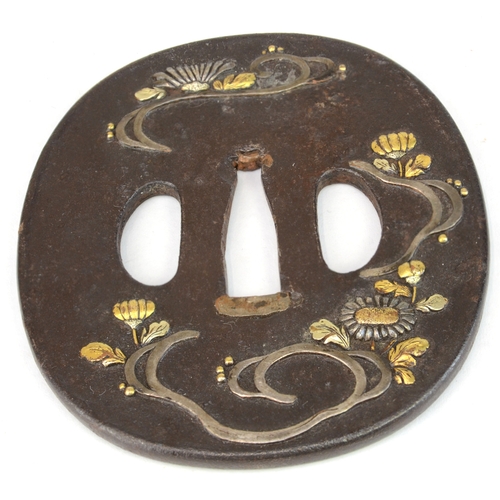 7021 - Five iron tsuba, small oval with bamboo stems in gold, oval with lily flowers, kakumarugata with che... 