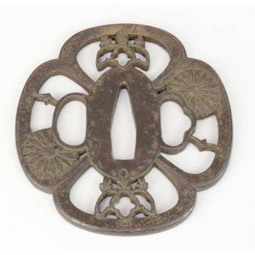 7022 - Three iron openwork tsuba, one decorated with a dragon, all unsigned

 Provenance 
 Henry Potter Ste... 