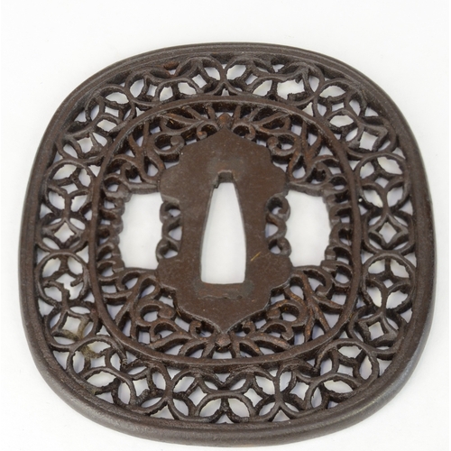 7022 - Three iron openwork tsuba, one decorated with a dragon, all unsigned

 Provenance 
 Henry Potter Ste... 