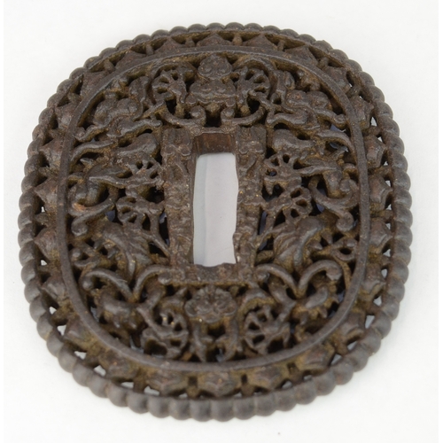 7022 - Three iron openwork tsuba, one decorated with a dragon, all unsigned

 Provenance 
 Henry Potter Ste... 