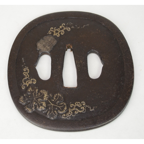 7023 - Three iron tsuba one decorated with prunus, one in Shoami style with leaves and the third with bambo... 