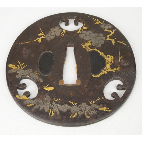 7023 - Three iron tsuba one decorated with prunus, one in Shoami style with leaves and the third with bambo... 