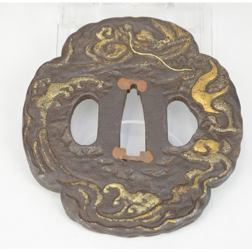 7026 - An iron mokko gata tsuba decorated in takazogan gilt work on one side with a tiger in bamboo, the ot... 