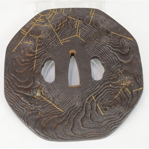7028 - An iron octagonal tsuba decorated with steel spiders and gold cobwebs, unsigned

 Provenance
 Henry ... 
