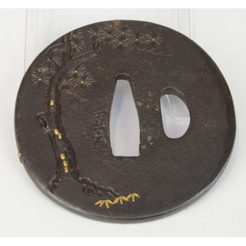 7032 - NAOMITSU- A circular iron tsuba decorated with a scholar and dragon in gold takazogan, the scholar l... 