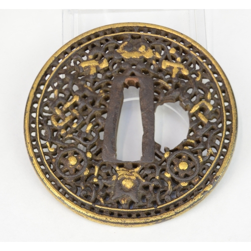 7039 - A circular openwork tsuba decorated with some ashtamangala (Buddhist) symbols the endless knot, whee... 