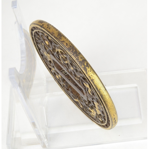 7039 - A circular openwork tsuba decorated with some ashtamangala (Buddhist) symbols the endless knot, whee... 