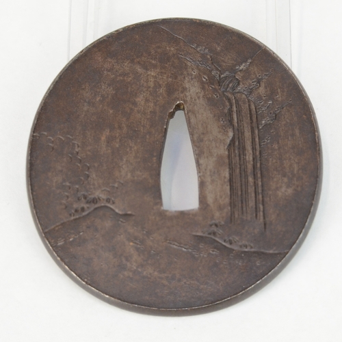 7042 - An oval iron tsuba decorated with an eagle in takazogan and a monkey in shishiaibori, signed

 Prove... 