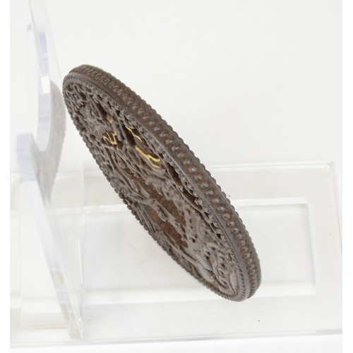 7043 - An iron openwork tsuba decorated with a dragons, waves and a pagoda style house, unsigned

 Provenan... 