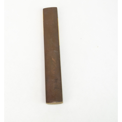 7054 - A mixed metal kozuka depicting a fish swimming amongst rocks, signed with two characters

 Provenanc... 