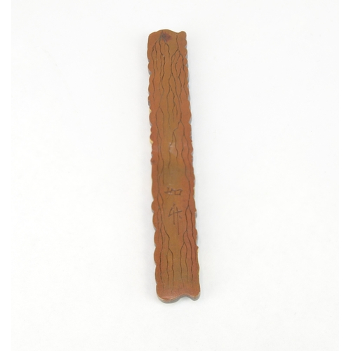 7055 - A mixed metal kozuka decorated in shakudo, gold and silver in high relief depicting all twelve junis... 