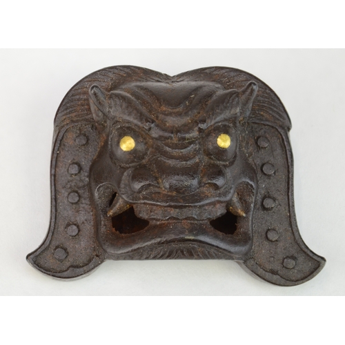 7061 - An iron mask with brass eyes, signed Myochin Kiyoharu but probably not by the maker

 4.2cm wide

 P... 