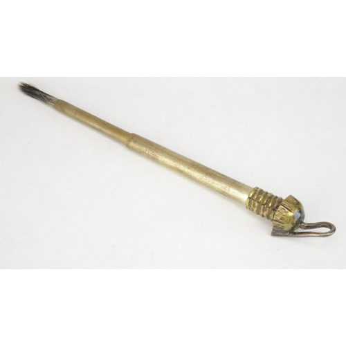 7062 - A brass Japanese yayate (portable writing set) in the form of a gourd with screw top that reveals br... 