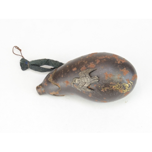 7063 - Three Japanese metal items to include a solid metal aubergine netsuke signed Tsunemitsu  together wi... 