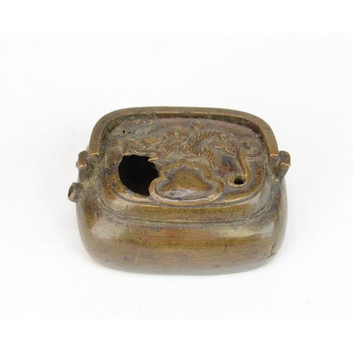 7063 - Three Japanese metal items to include a solid metal aubergine netsuke signed Tsunemitsu  together wi... 
